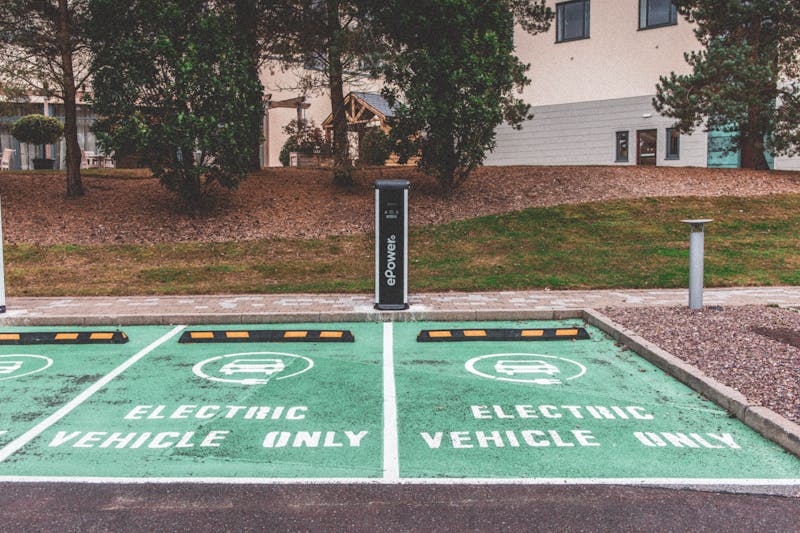 Electric vehicle parking with charging station in urban environment